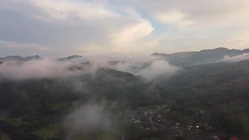 Fog Over Mountains And Village, Aerial View