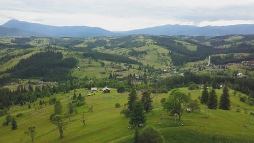 Lush Green Mountains and Rolling Hills Aerial View