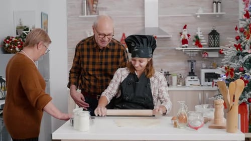 Child Chef Bakes Christmas Cookies with Grandparents