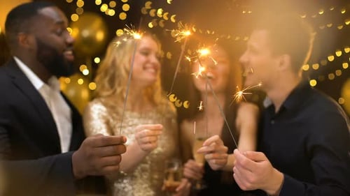 Friends Celebrate with Sparklers at Birthday Party
