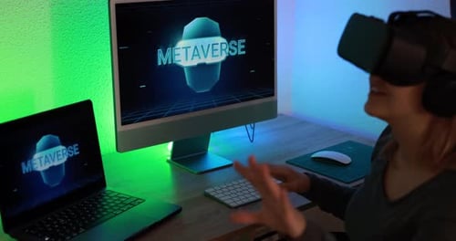 Woman Wearing VR Headset Using Computer