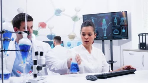 Scientists Conduct Medical Research Experiment in Bright Lab