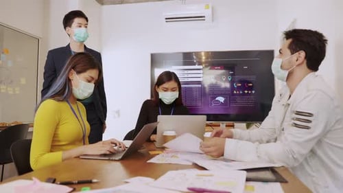 Business Team Meeting with Face Masks at Office
