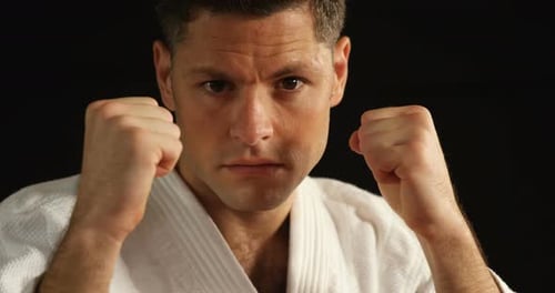 Man Punches in Martial Arts Outfit