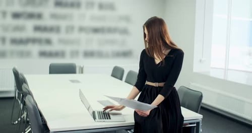 Sitting on Table Concerned Woman Working and Thinking Solving Problem at Office. Serious Attractive