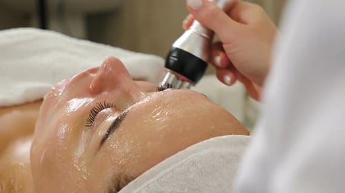 Woman Receives Facial Treatment in Beauty Spa