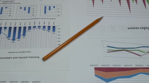 Business Graphics Sales Company On The Desk In The Office