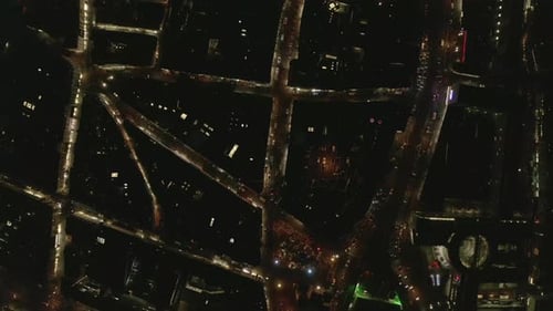 AERIAL: Slow Overhead Shot of City at Night with Lights and Traffic, Cologne, Germany