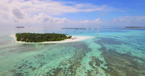 Aerial drone view of a scenic tropical island in the Maldives