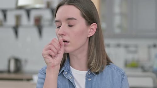 Woman Coughing in a Close Up Shot