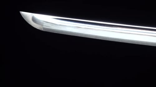 Dramatic Studio Shot of Man Holding Samurai Sword. Close Up