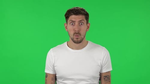 Portrait of Confident Guy with Shocked Surprised Wow Face Expression. Green Screen