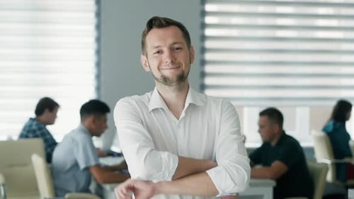 Portrait of Happy Office Worker Looking at Camera in Modern Office, Positive Male Employee with