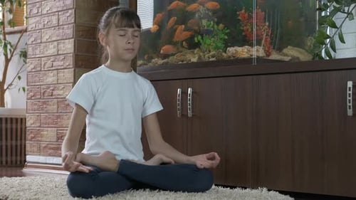 Girl Doing Yoga and Meditating at Home