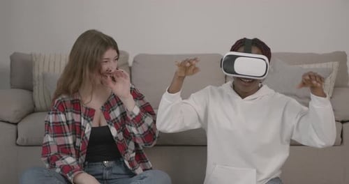 Woman Playing VR Game with Friend