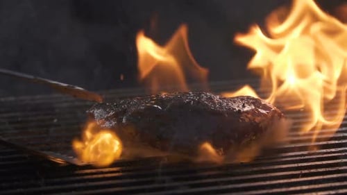 Steak Cooking on Fiery Grill