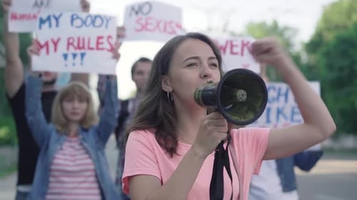 Woman Speaks Into Megaphone During Protest
