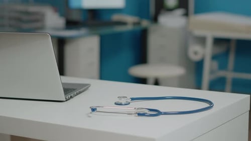 Close Up of Professional Stethoscope Placed on White Desk
