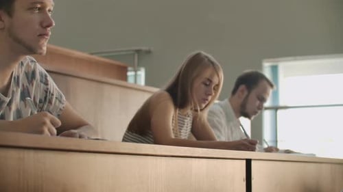 The Camera Moves Through the Class Between the Rows