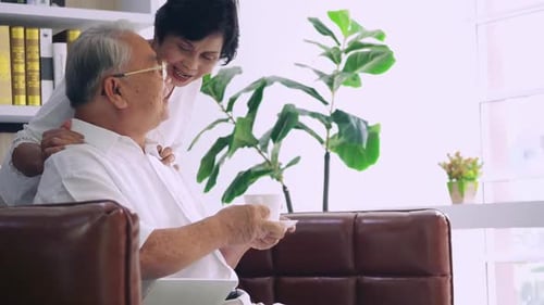Loving Senior Couple Relaxing Together at Home