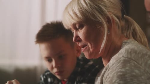 Teenager Using Grandma to Use Cellphone