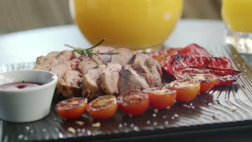 Pork Tenderloin with Grilled Vegetables on Plate
