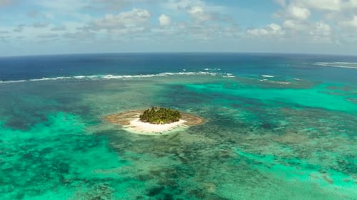 Tropical Guyam Island with a Sandy Beach and Tourists