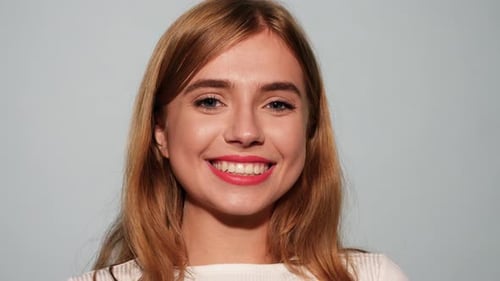 Smiling Woman Winking with Red Lipstick, Close Up