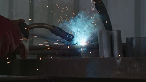 Metal Welding Close Up With Sparks and Smoke