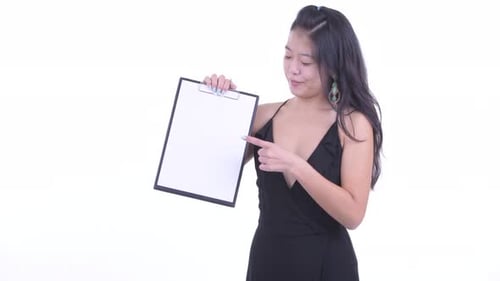 Young Woman Presents Clipboard with Thumbs Up