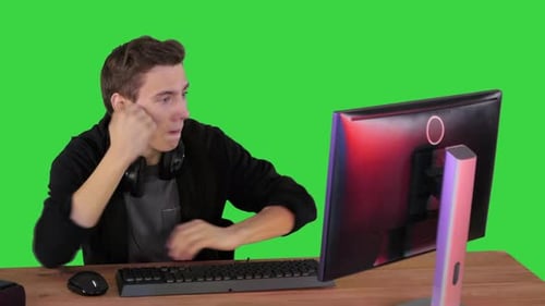 Happy Emotions of a Gamer Watching Steam on a Green Screen, Chroma Key.
