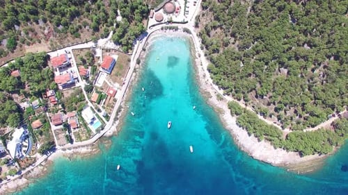 Aerial view of people swimming in turquoise waters of island of Brac, Croatia