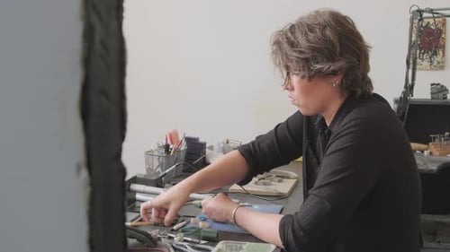 Side View of Jeweler Creating Wax Mold