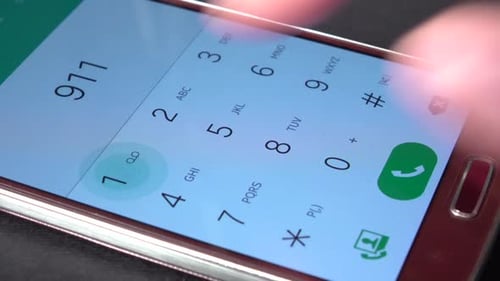 Hand dials number on a smart phone