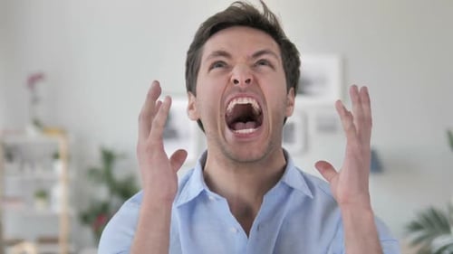 Man Shouts in Anger and Frustration