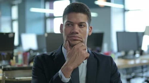 Man Thinking in Office Close Up