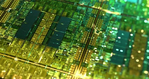 Electronic computer hardware, silicon wafer with gold elements.