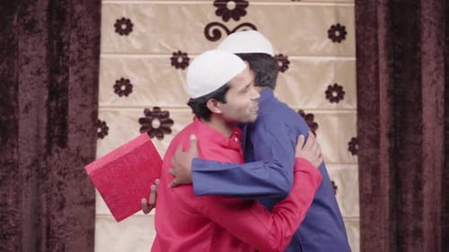 Two Muslim man wishing Happy Eid to each other