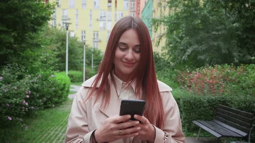 Businesswoman Walking with Smart Phone in City Commuting to Work