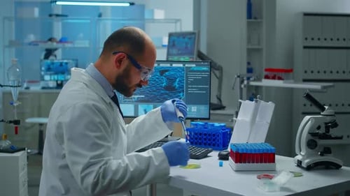 Scientist Experimenting With Samples in Bright Lab