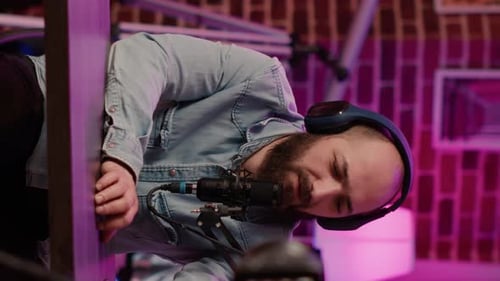 Bearded Man Recording Audio on Microphone