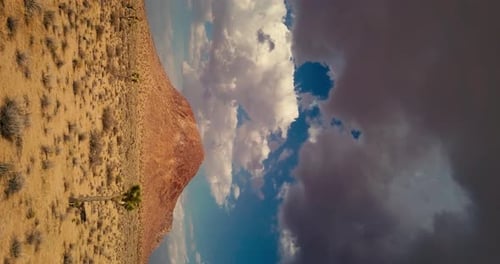 Heavy storm clouds floating over Mojave Desert landscape before rain