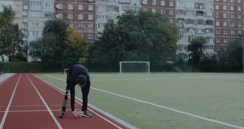 Man with Prosthetic Leg Stretching Before Workout