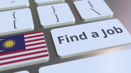 FIND A JOB Text and Flag of Malaysia on the Keyboard