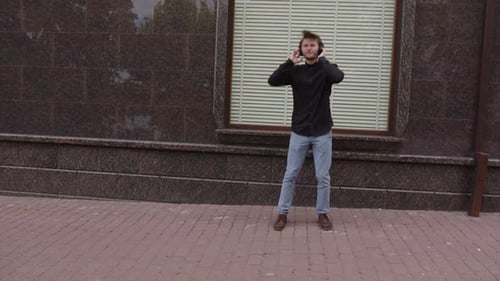 Young Adult Dancing with Wireless Headphones