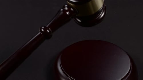 Wooden Gavel Hits Sounding Block Close Up