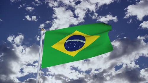 Brazil Flag Waving In The Wind With Blue Sky And Clouds