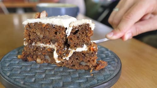 Close Up of Carrot Cake Slice Being Eaten