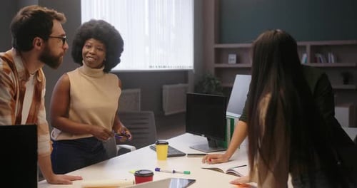Team Meeting at a Standing Office Desk