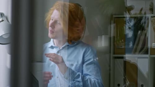 Young Adults Discussing Business Strategy at Office